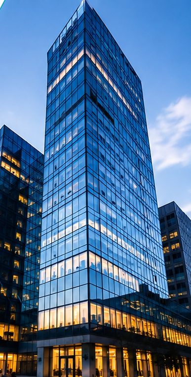 Modern glass office towers at dusk